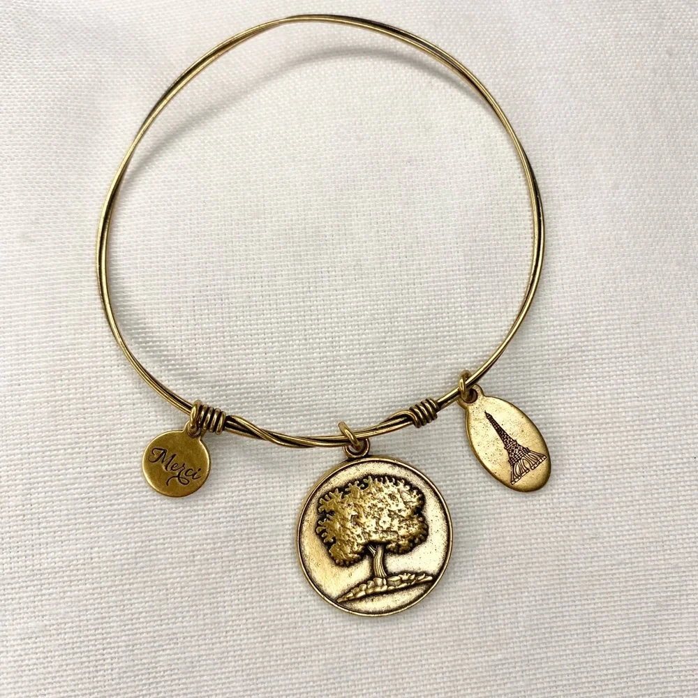 Gold tone bracelet family tree, “merci”, Eiffle tower charm